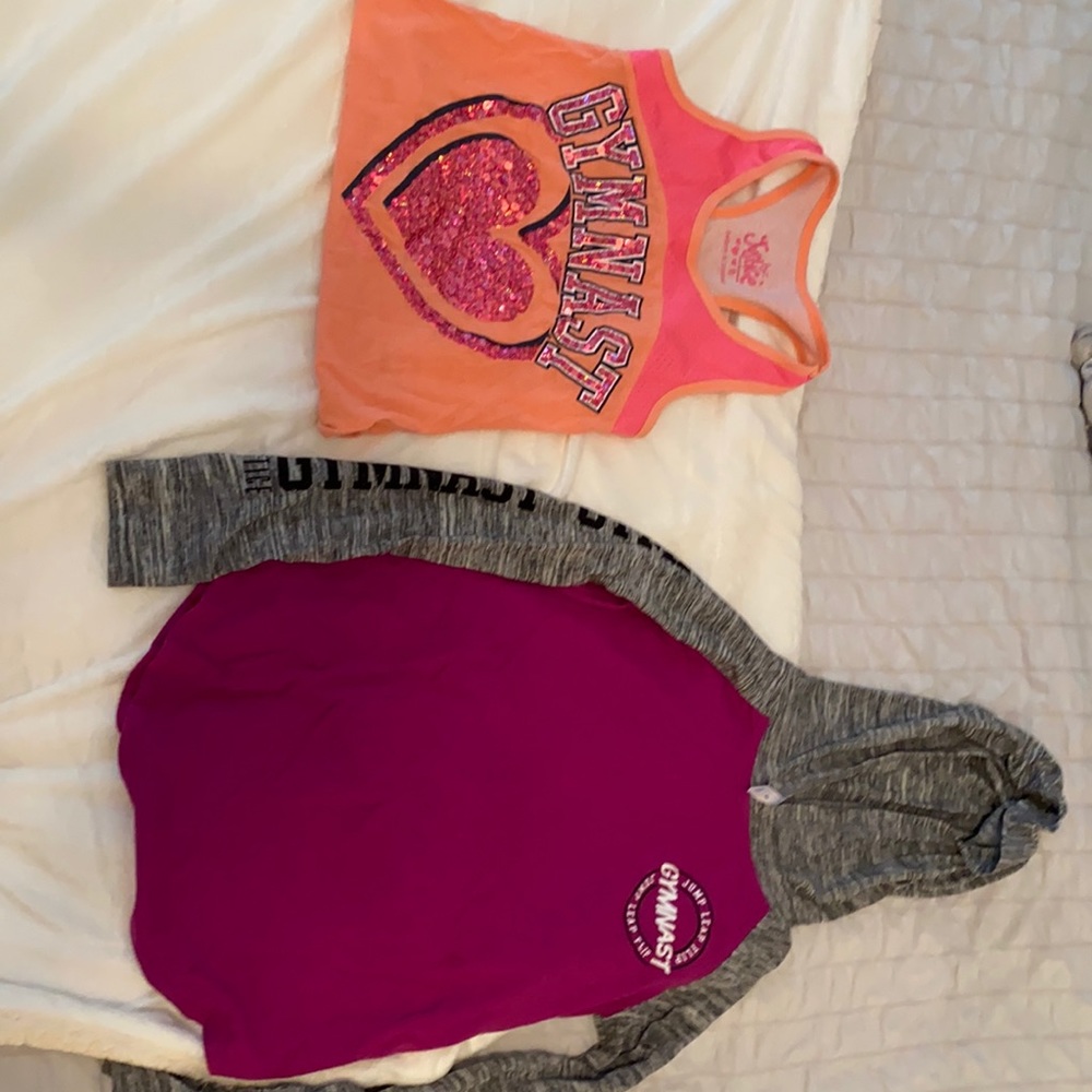 Two gymnastics Justice shirts.